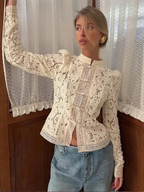 Women's lace blouse featuring a stand neck, long sleeves, and delicate lace detailing, perfect for elegant layering.