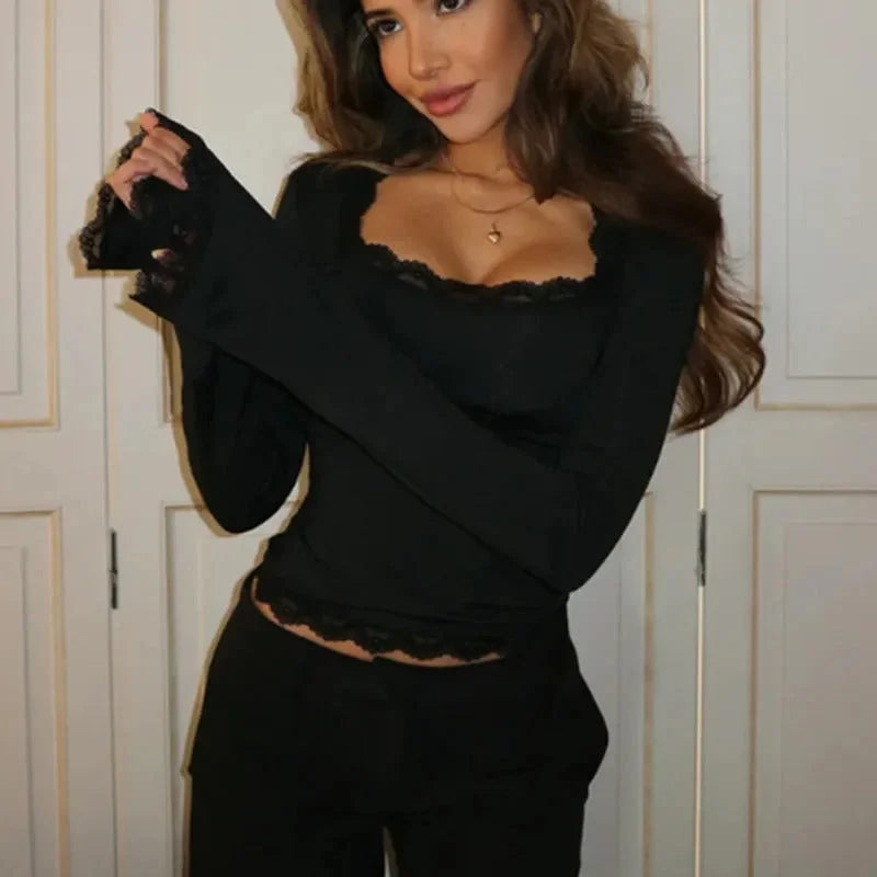 Women's long sleeve top with lace trim, made from soft cotton blend fabric for comfort and breathability.