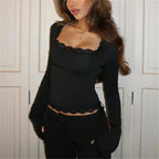 Women's long sleeve top with lace trim detailing, made from soft, breathable fabric for comfortable wear.