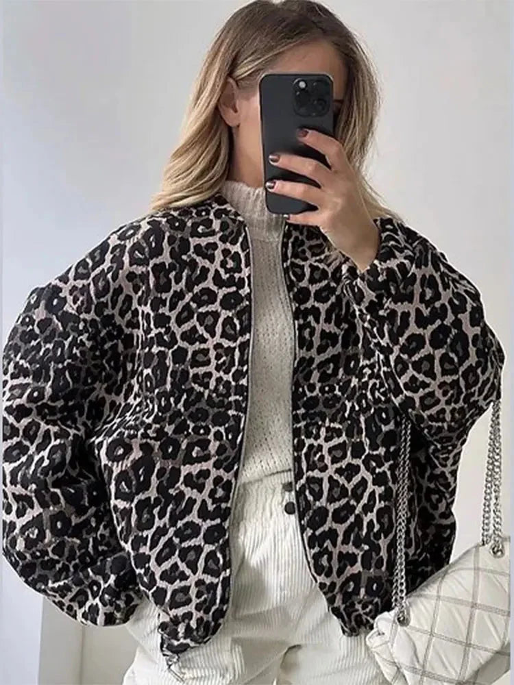 Women's leopard print bomber jacket made of soft polyester with ribbed cuffs and a stylish zip-up front.