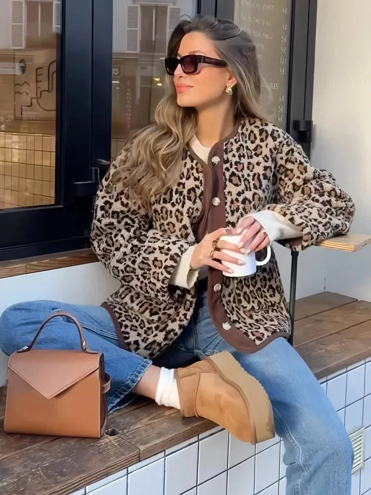 Women's leopard print cardigan featuring a button-up front, made from a soft, lightweight fabric for comfort and style.