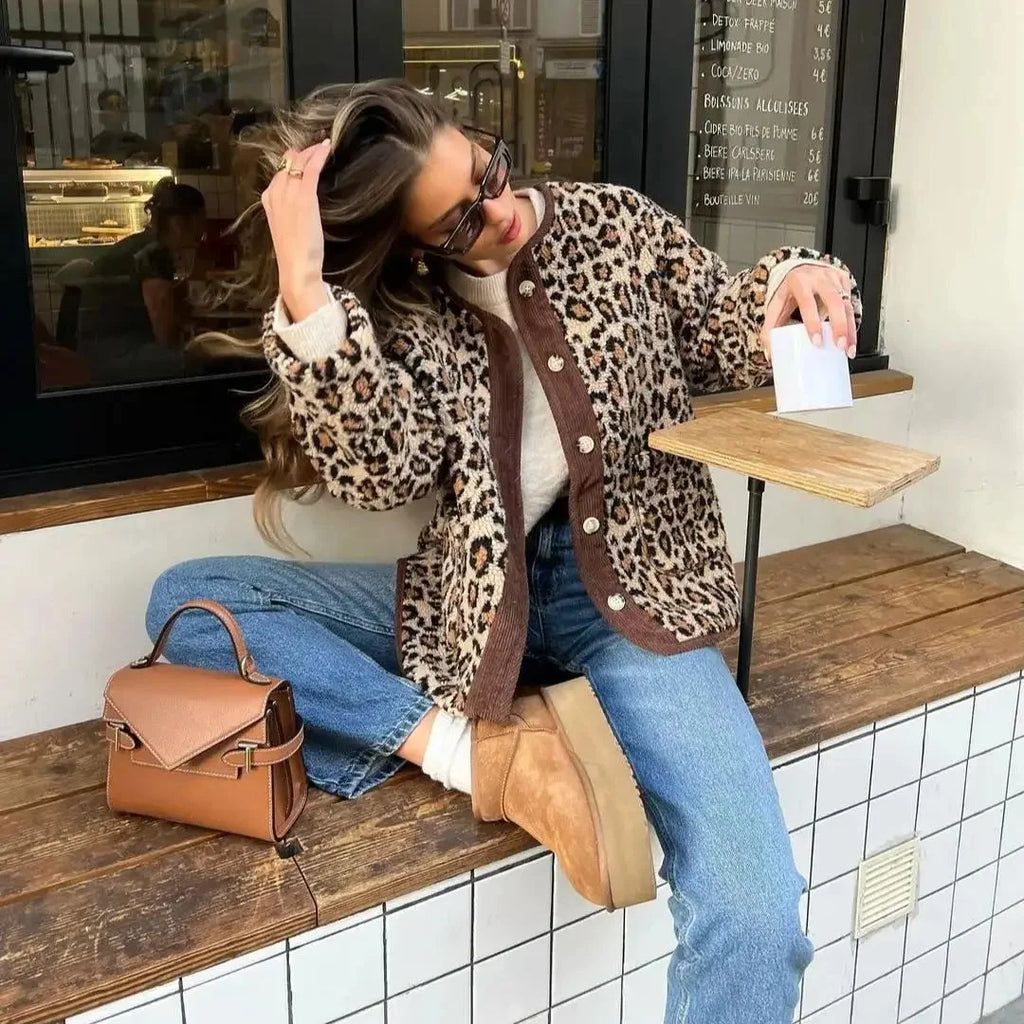 Women's leopard print cardigan featuring a button-up front, made from soft knit material for comfort and warmth.