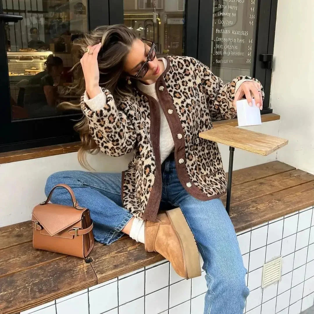 Women's leopard print cardigan featuring a button-up front, made from soft knit material for comfort and warmth.