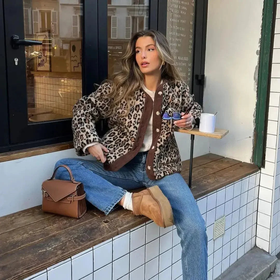 Women's leopard print cardigan made from soft knit fabric, featuring a button-up front and cozy long sleeves.