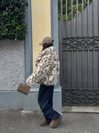 Women's leopard print faux fur jacket featuring long sleeves and a soft, textured finish for a stylish and cozy look.