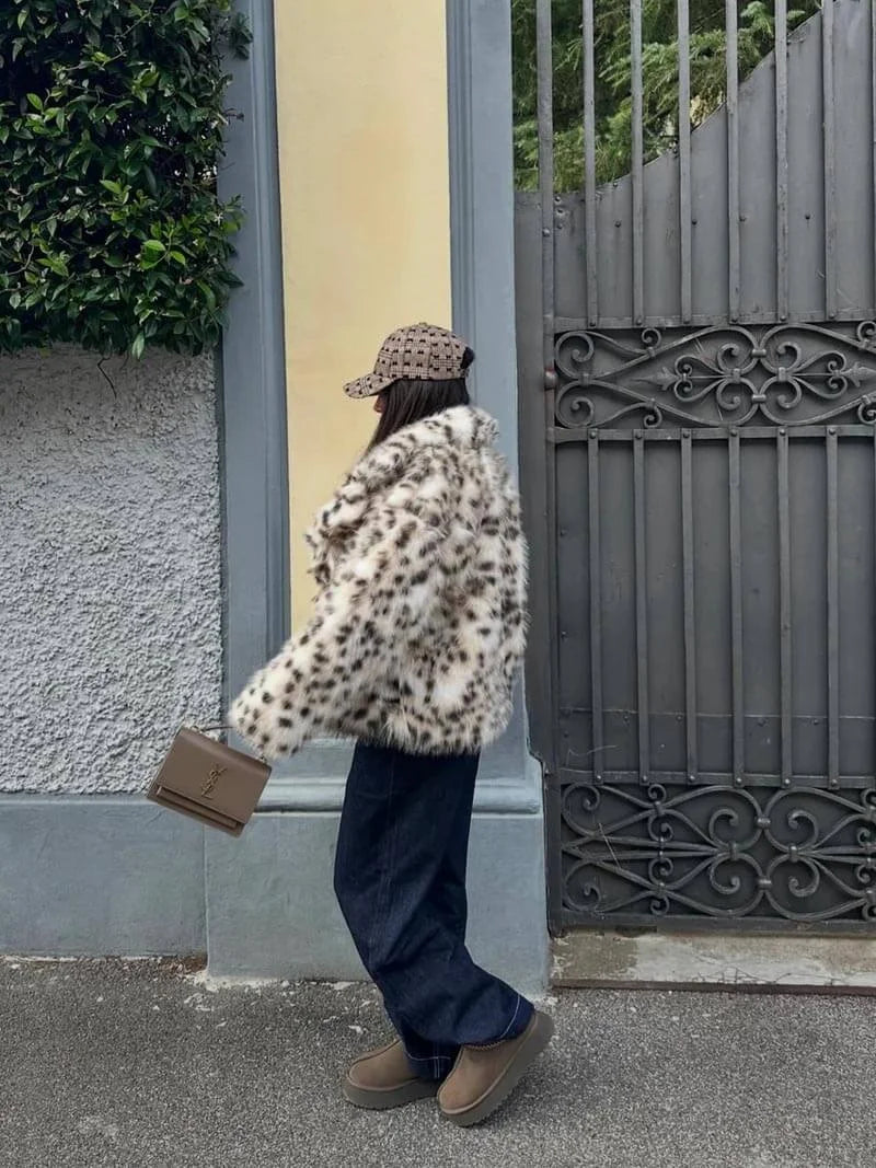 Women's leopard print faux fur jacket featuring long sleeves and a soft, textured finish for a stylish and cozy look.