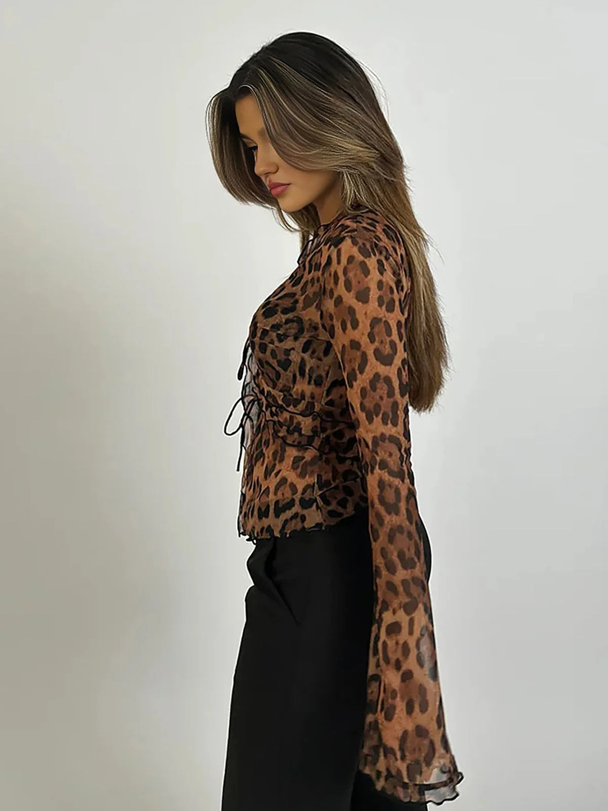 Women's long sleeve mesh blouse featuring a stylish leopard print design and lightweight material for breathable comfort.