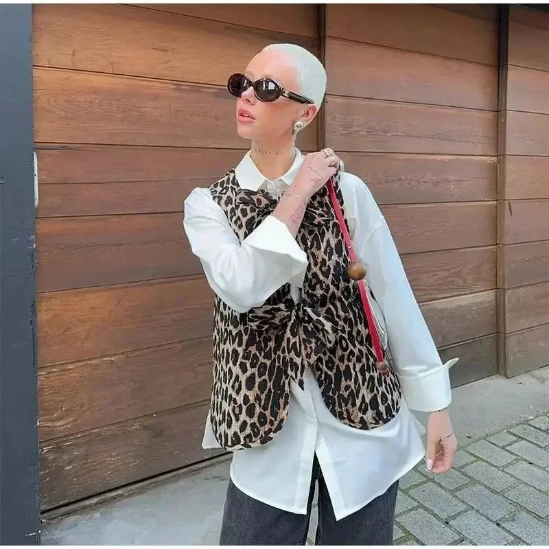 Women's leopard print vest with bow ties, made from soft fabric, featuring a stylish animal print and adjustable tie details.