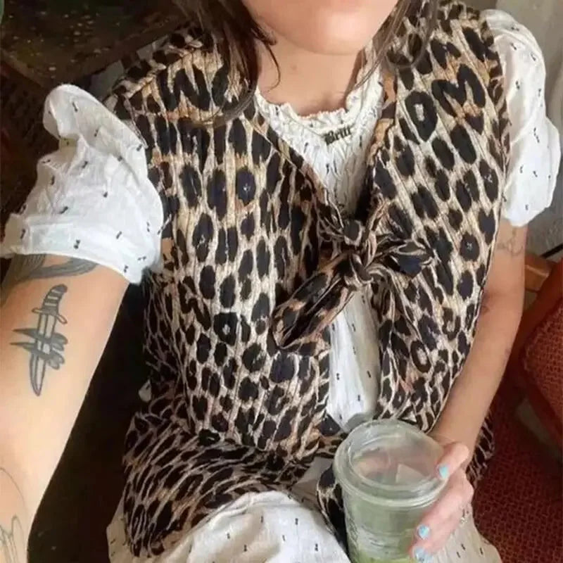Women's leopard print vest featuring bow ties, made of soft fabric with a stylish, relaxed fit and adjustable ties.