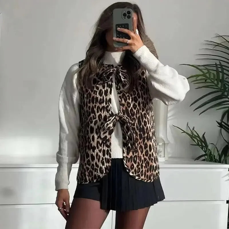 Women's leopard print vest with bow ties, made of soft fabric, featuring a stylish pattern and adjustable bow tie details.