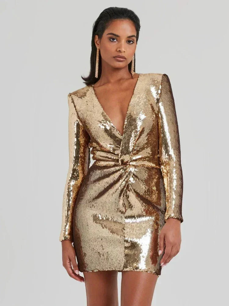 Women’s long-sleeve gold sequined mini dress with a fitted silhouette and shimmering fabric, perfect for party wear.