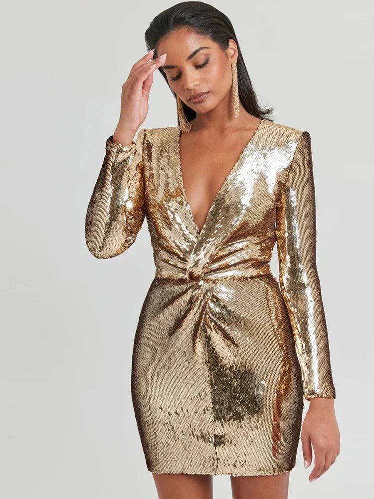 Gold sequined long-sleeve mini dress for women, featuring a fitted silhouette and shimmering texture perfect for parties.