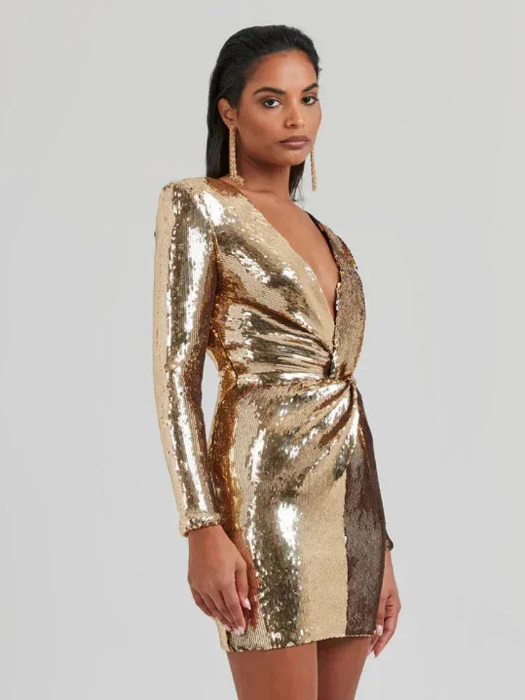 Women's long-sleeve mini dress featuring gold sequins, a fitted silhouette, and a soft fabric for a stylish party look.