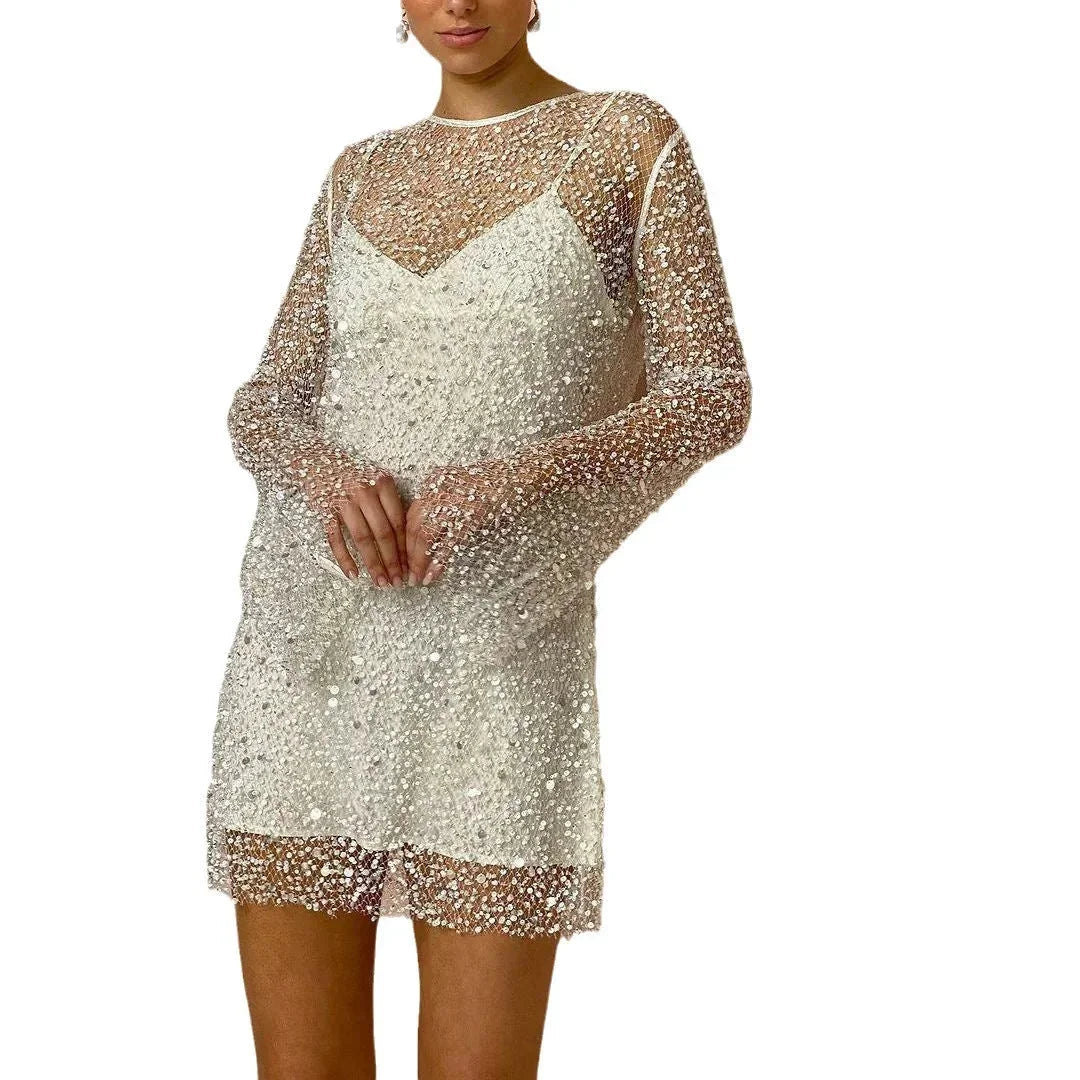 Women's long sleeve mini party dress with sequined fabric, designed with a fitted silhouette and elegant round neckline.