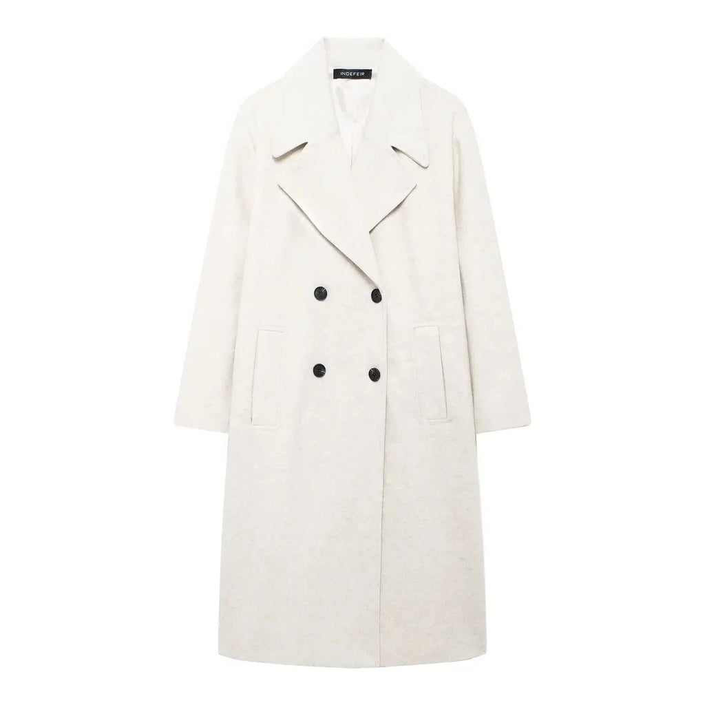 Women's long structured coat in a loose fit, made of durable fabric with a sleek silhouette and oversized pockets.