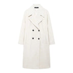 Women's long structured coat in a loose fit, made of durable fabric with a sleek silhouette and oversized pockets.