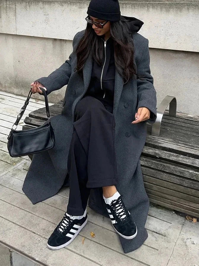 Women's long structured coat in soft wool blend, featuring an oversized fit and tailored silhouette for a modern look.