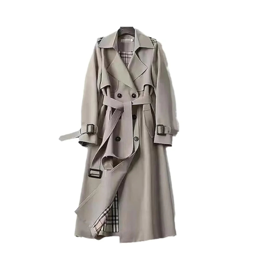 Women's long trench coat in breathable fabric with a belted waist and classic lapels, perfect for stylish layering.