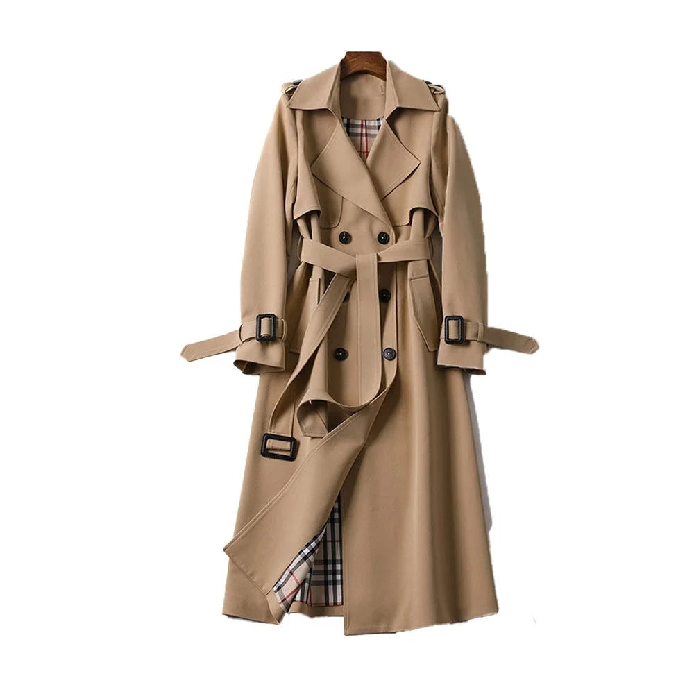 Women's long trench coat with a belted waist, lapels, and durable fabric, perfect for layering in colder weather.