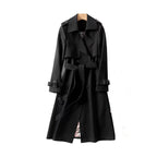 Women's long trench coat in durable fabric, featuring a belted waist and classic lapels for a stylish, tailored look.