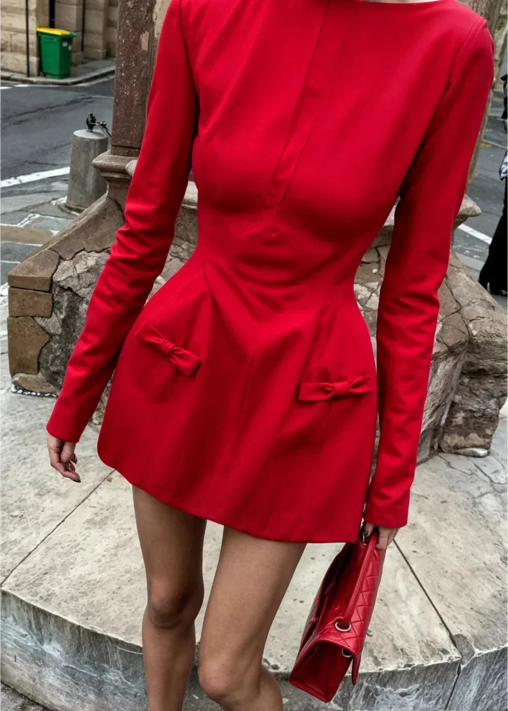 Women's mini dress with long sleeves, bow accents, and soft fabric, perfect for casual outings or evening events.