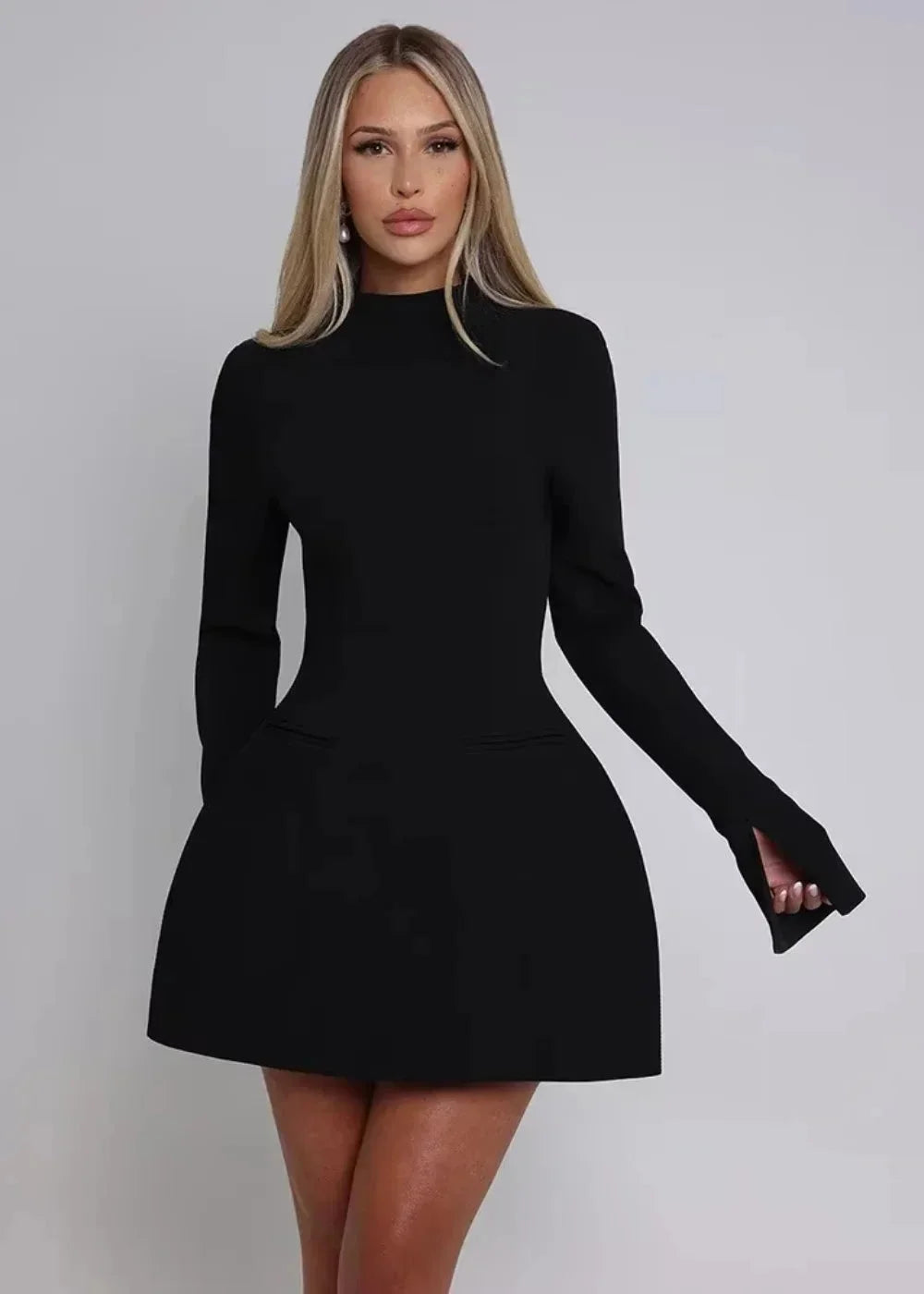 Women's mini dress featuring flared long sleeves, an open back, and soft fabric for comfort and style. Ideal for casual…