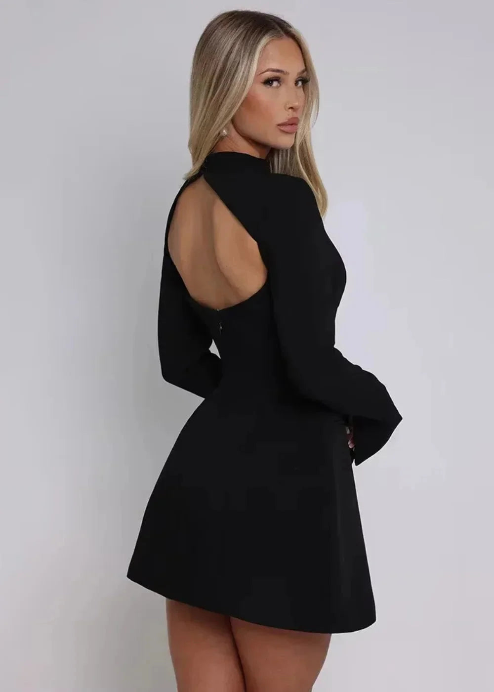 Women's mini dress featuring flared long sleeves, an open back design, and crafted from lightweight, breathable fabric.