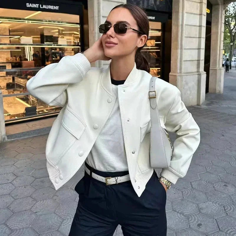 Women's modern bomber jacket made of durable fabric, featuring front pockets and a sleek, fitted design for everyday wear.