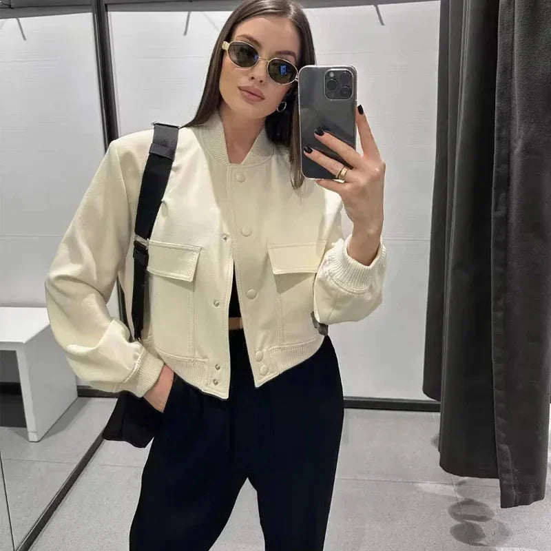 Women's bomber jacket in durable fabric, featuring front pockets and a sleek, modern design for effortless style and comfort.