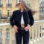 Women's modern bomber jacket in lightweight fabric, featuring front pockets and a relaxed fit for casual wear.