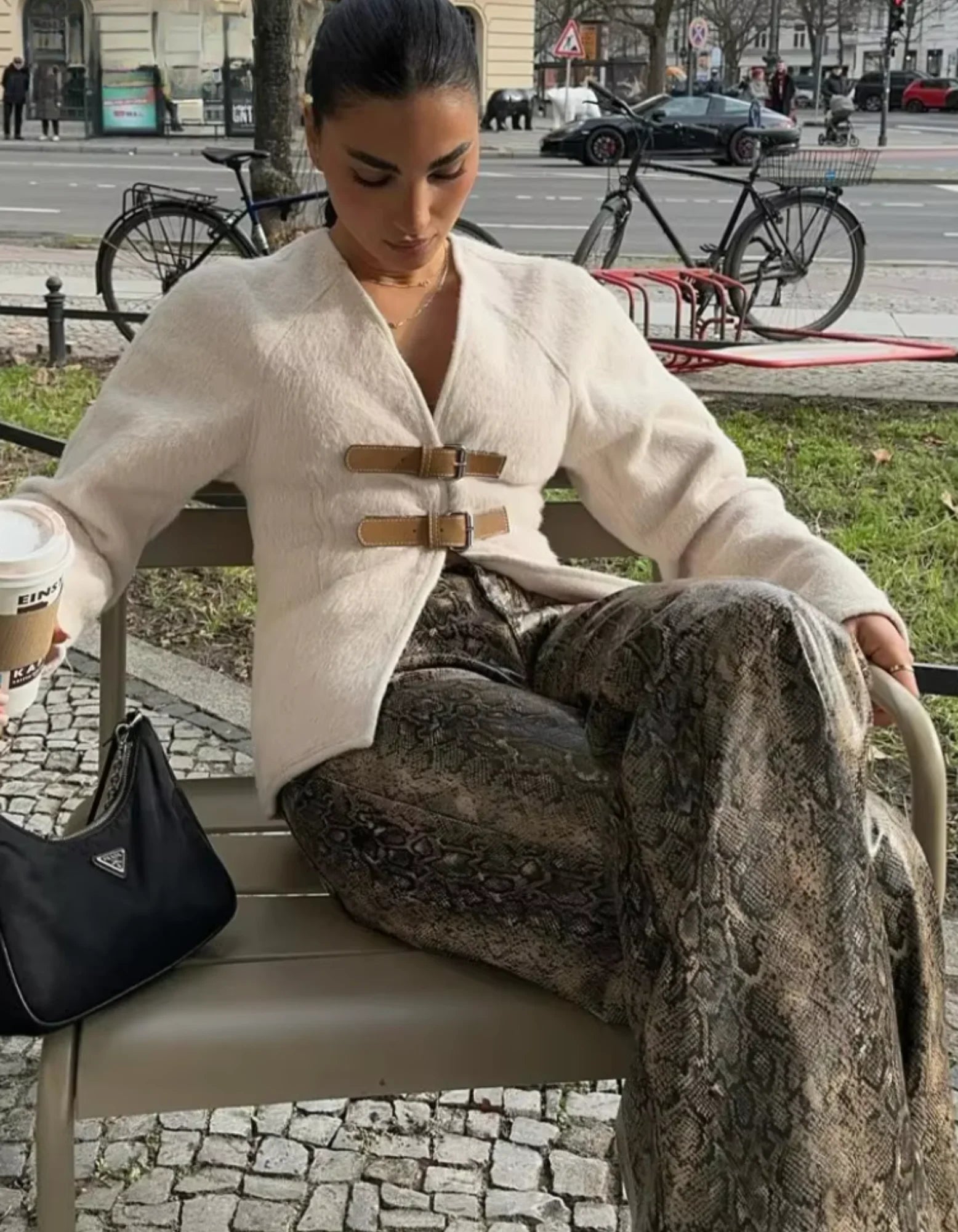 Women's modern strap cardigan featuring beige accents, crafted from soft fabric with an open front and relaxed fit.