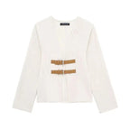 Women's modern strap cardigan in soft knit with beige accents, featuring a relaxed fit and open-front design.
