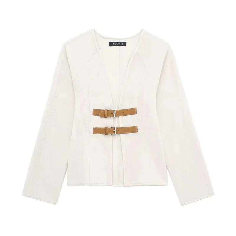 Women's modern strap cardigan in soft knit with beige accents, featuring a relaxed fit and open-front design.