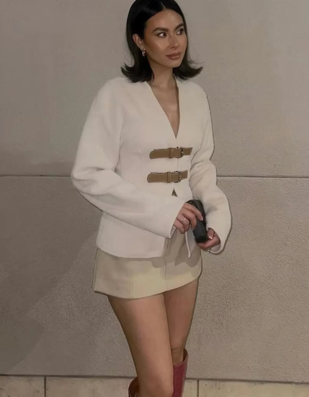 Women's modern strap cardigan featuring beige accents, made from soft, breathable fabric with a sleek, contemporary design.