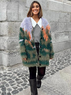 Women's multicolor fuzzy cardigan with long sleeves, crafted from soft, cozy fabric featuring a playful, vibrant pattern.