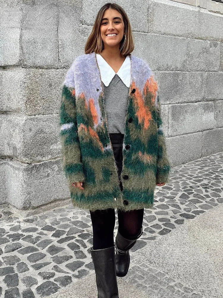 Women's multicolor fuzzy cardigan with long sleeves, crafted from soft, cozy fabric featuring a playful, vibrant pattern.