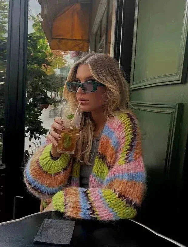 Women's multicolor knitted cardigan featuring a playful pattern and soft yarn for cozy warmth and style in various outfits.