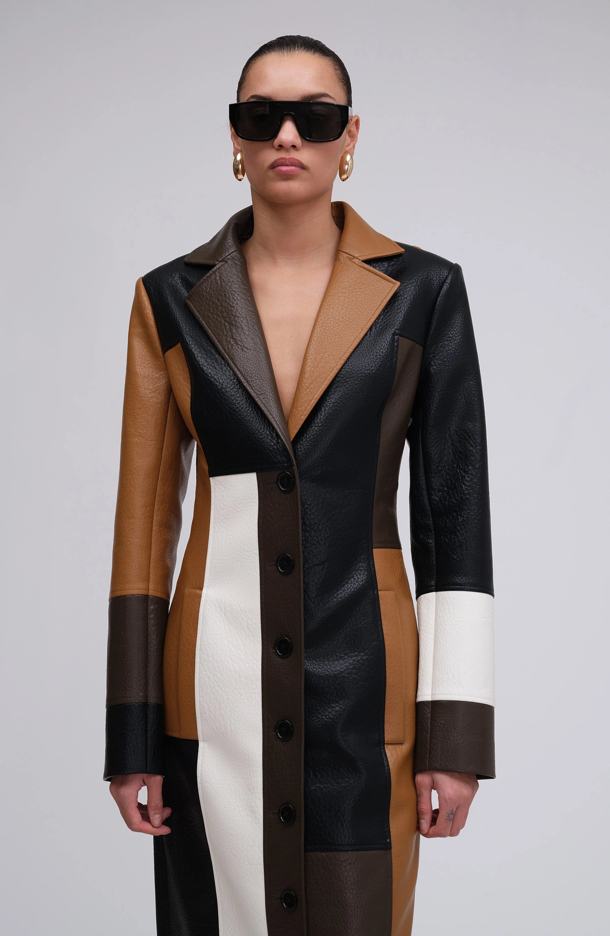 Multicolor patchwork long coat for women, featuring buttons, crafted from soft fabric with a unique design and distinct…