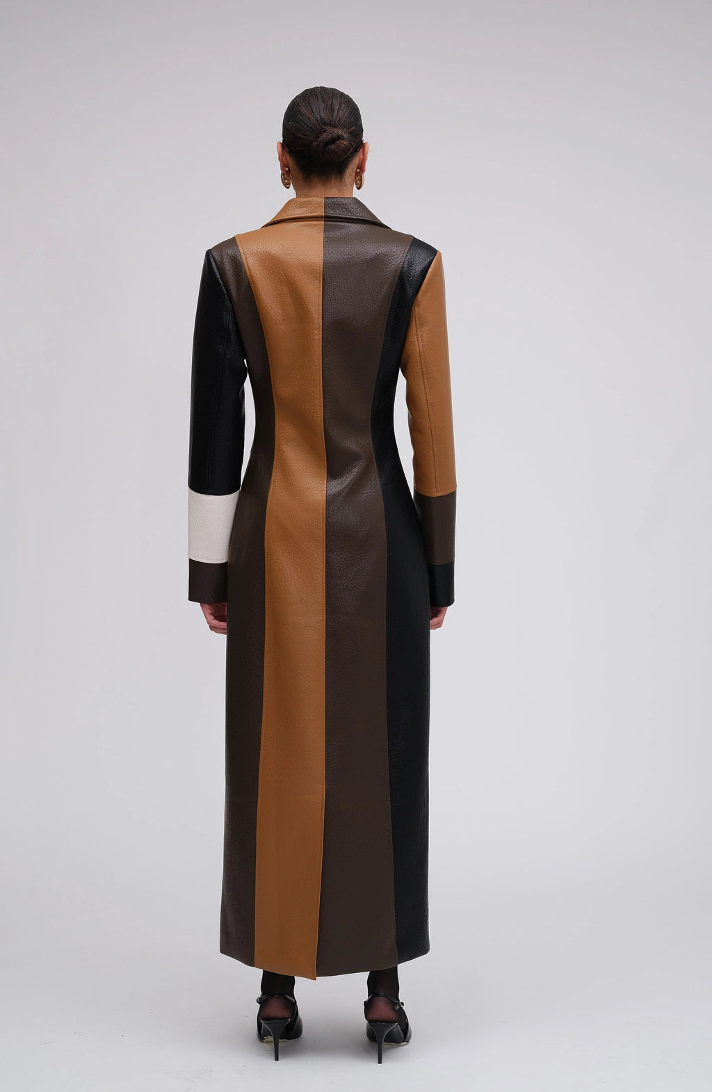Multicolor patchwork long coat for women featuring button closure and a cozy blend of fabrics for warmth and style.
