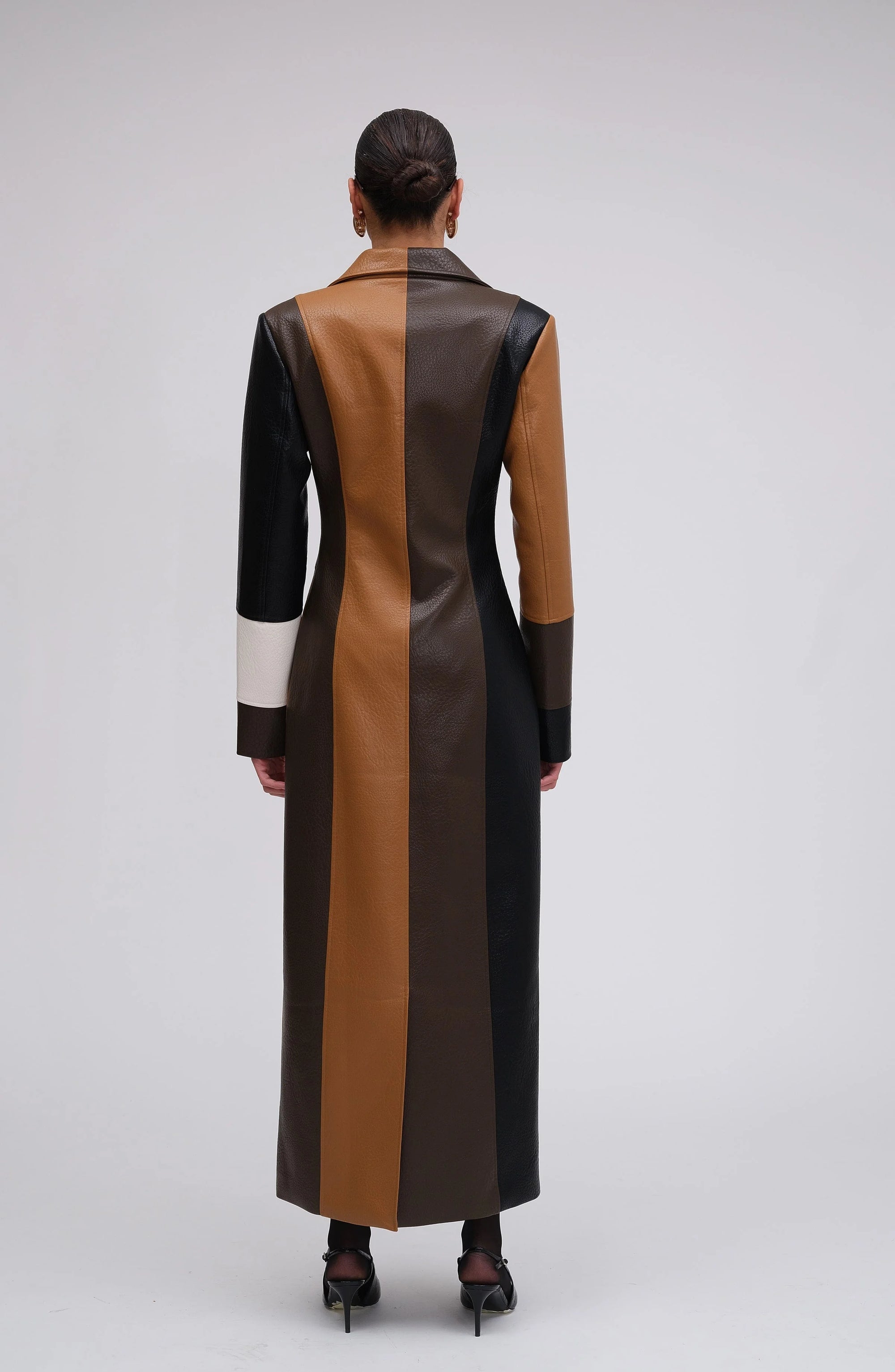 Multicolor patchwork long coat for women featuring button closure and a cozy blend of fabrics for warmth and style.