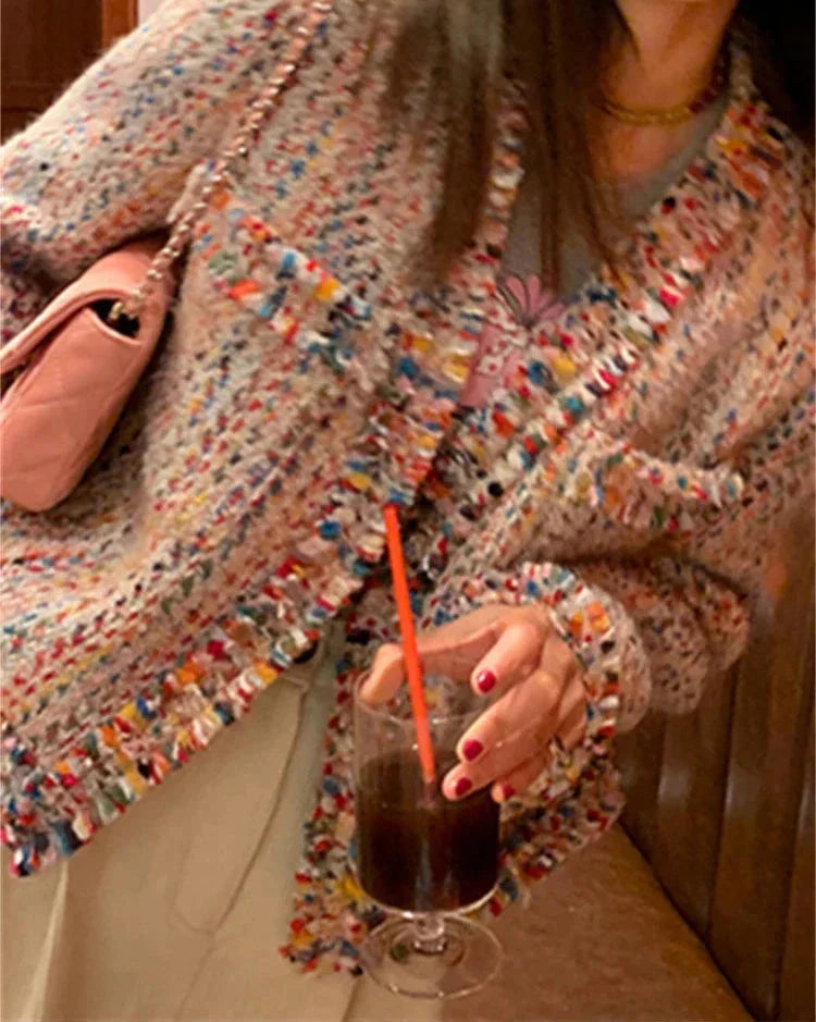 Women's multicolor tweed jacket featuring fringed edges, textured fabric, and a stylish, contemporary design suitable for…