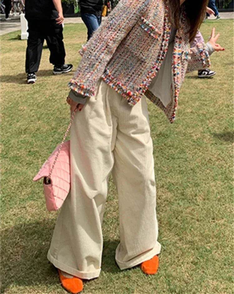 Multicolor tweed jacket for women featuring fringed edges and a classic design, perfect for layering in cooler weather.