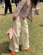 Multicolor tweed jacket for women featuring fringed edges and a classic design, perfect for layering in cooler weather.