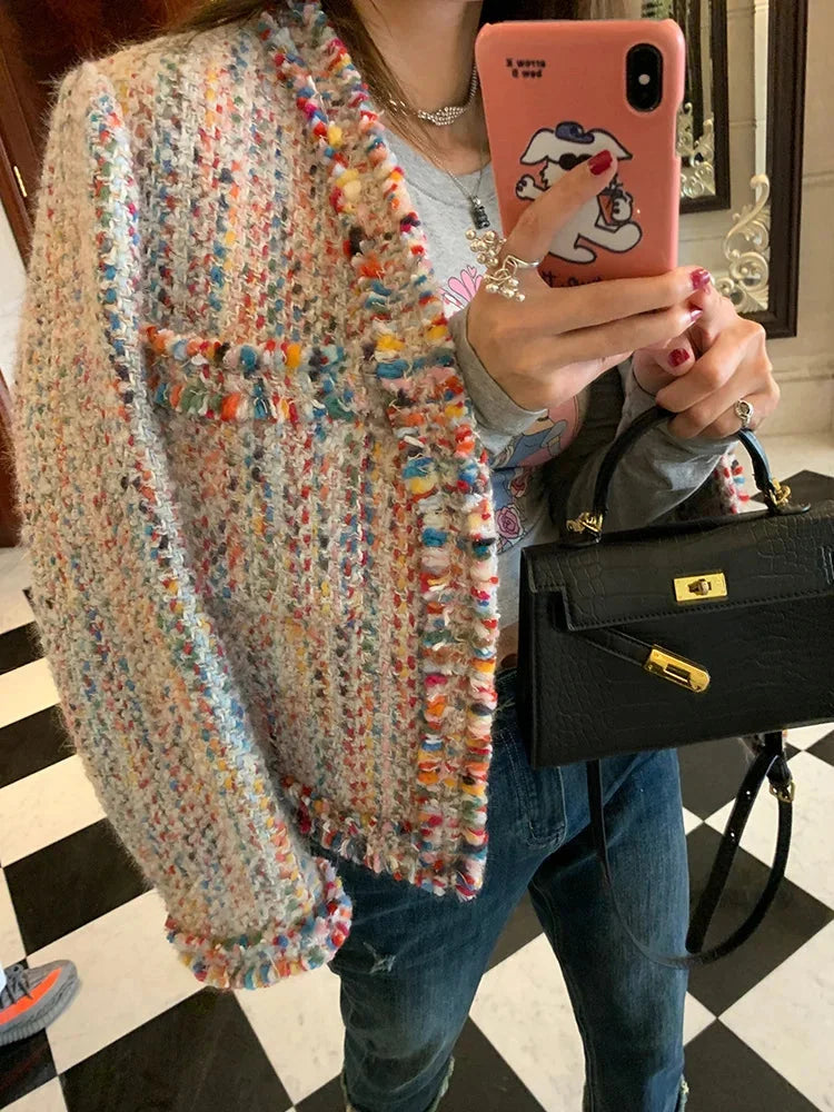 Women’s multicolor tweed jacket featuring fringed edges, classic fit, and textured fabric for a stylish and comfortable look.
