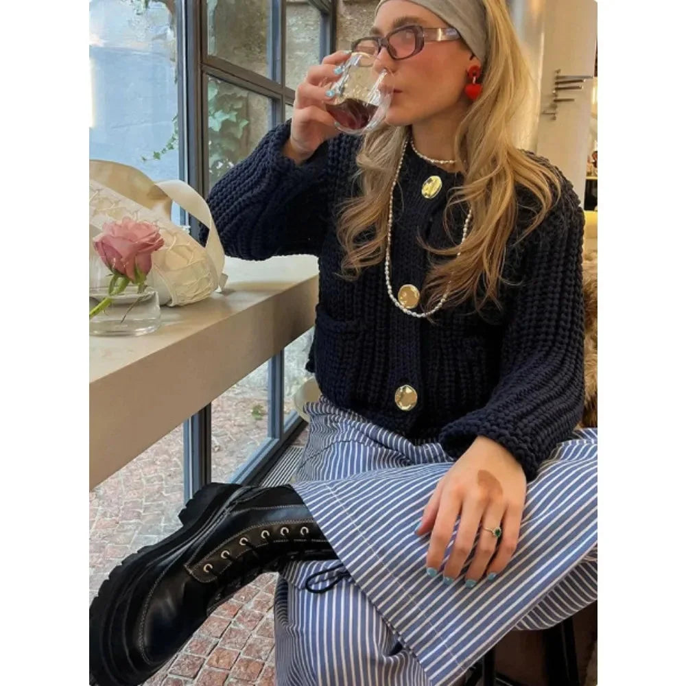 Women's navy cardigan with buttons, relaxed fit, made from soft cotton blend for comfort and easy styling.