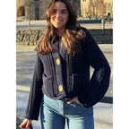 Women's navy buttoned cardigan in a relaxed fit made from soft cotton blend, featuring a classic design and ribbed cuffs.