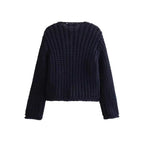 Women's navy buttoned cardigan in soft knit material with a relaxed fit and classic button-front design for easy layering.