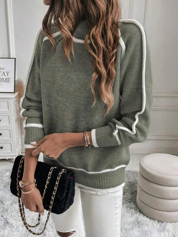Olive green turtleneck sweater for women featuring white accents, crafted from soft knit material for warmth and comfort.