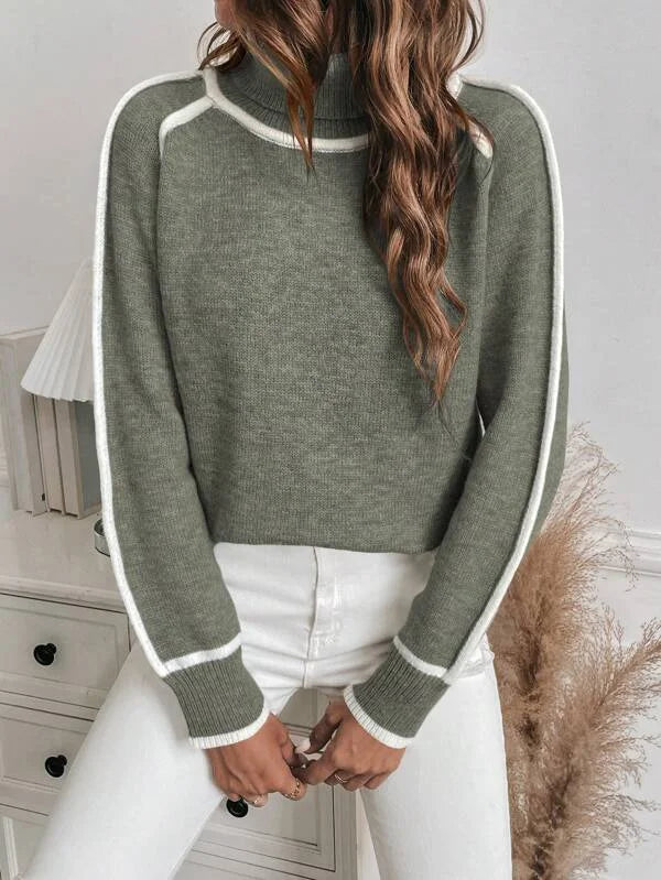 Olive turtleneck sweater for women featuring white accents and soft, warm fabric, perfect for layering in cooler weather.