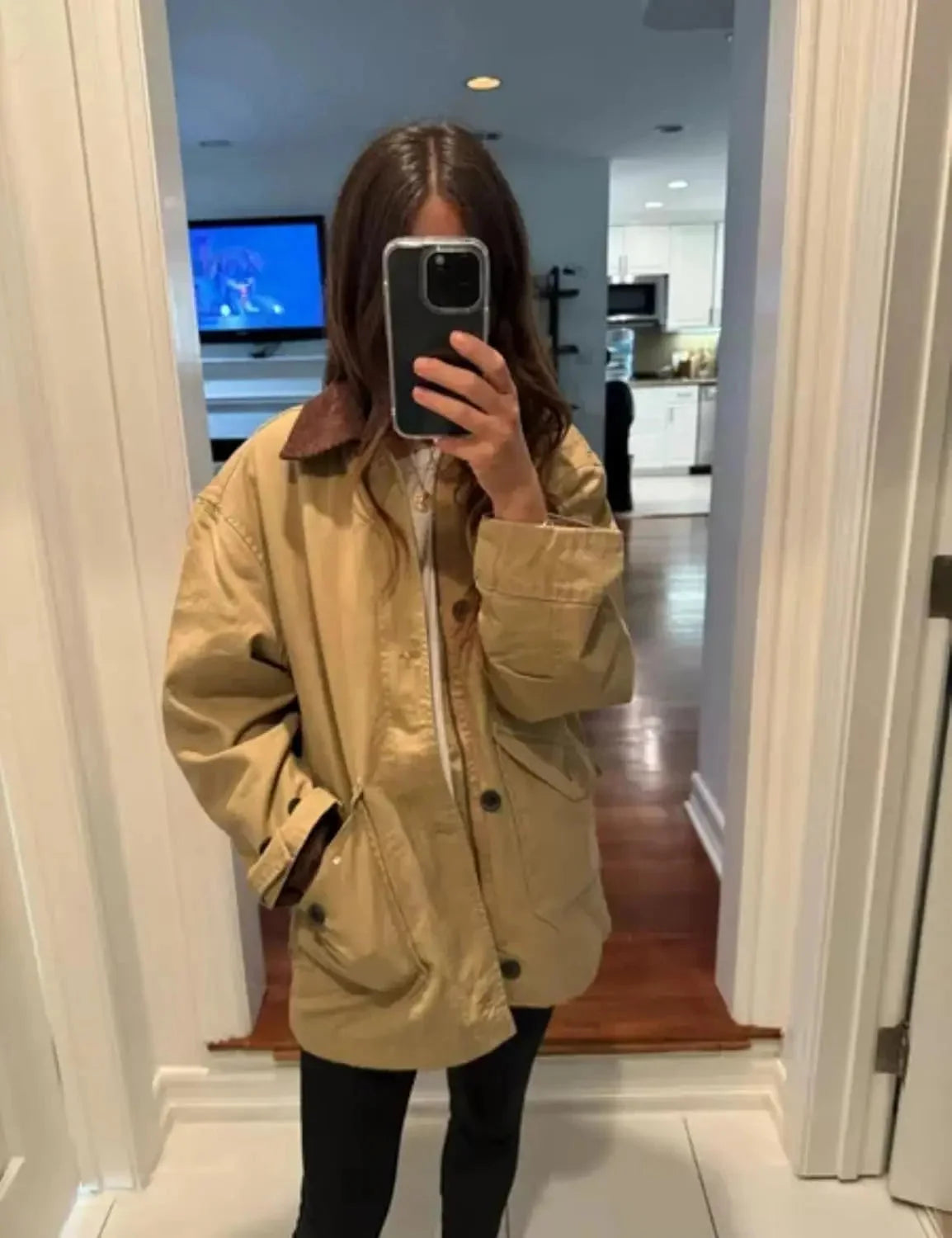 Women's oversized barn jacket featuring a corduroy collar, made of durable cotton blend, perfect for casual layering in…